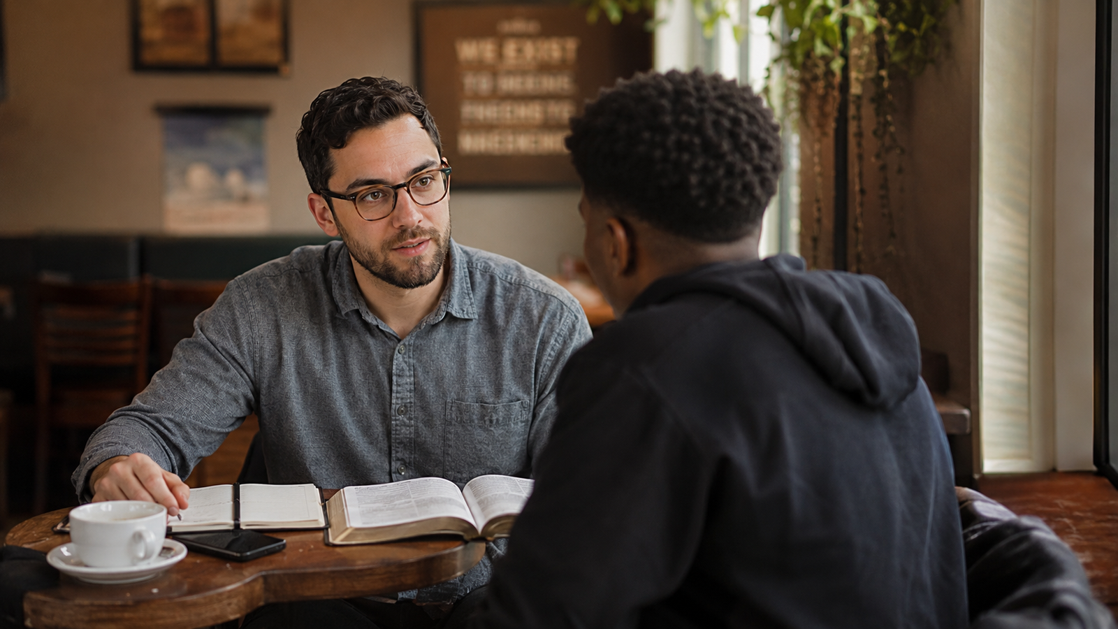 Pastor having coffee with a church member